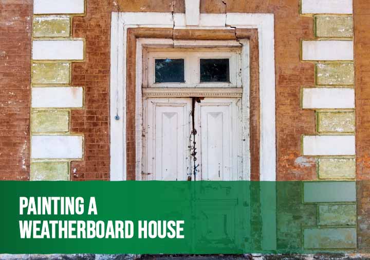 Painter applying fresh exterior paint to a weatherboard house after proper surface preparation.